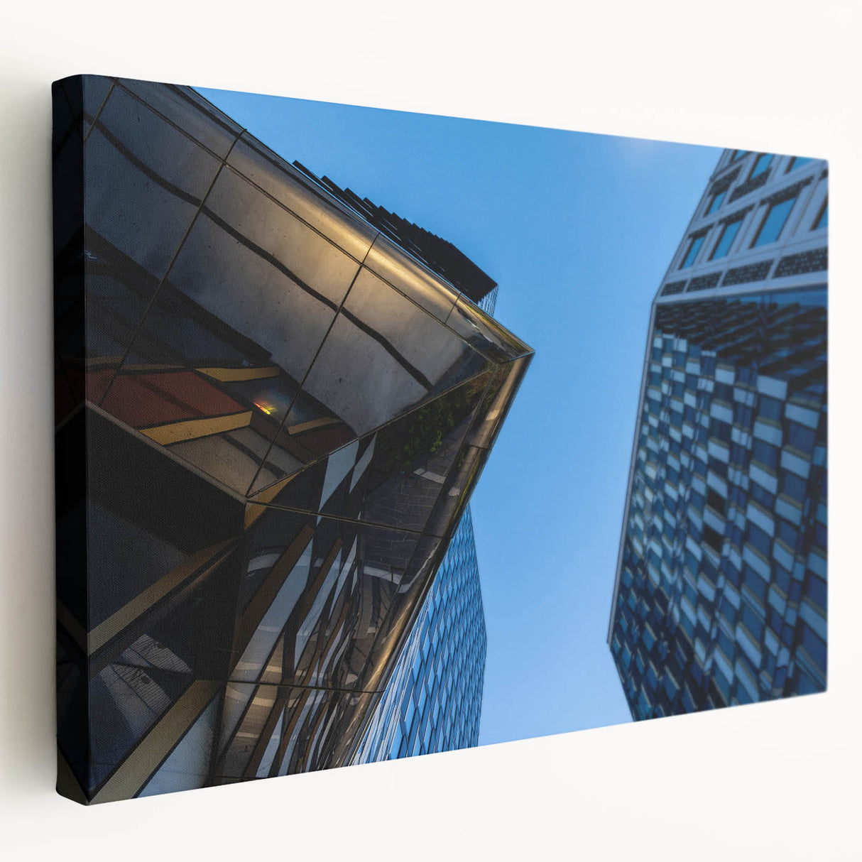 Large art depicting Stockholm scenery in muted blue and orange tones on stretched canvas, suitable for kitchen wall art.