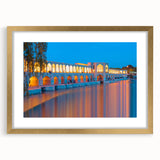 Extra large framed wall art depicting an abstract Middle-Eastern scenery in textured gold and beige tones.