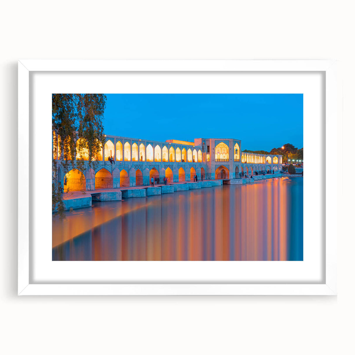 Abstract art print depicting a Middle Eastern scenery in muted earth tones on a white matted frame.