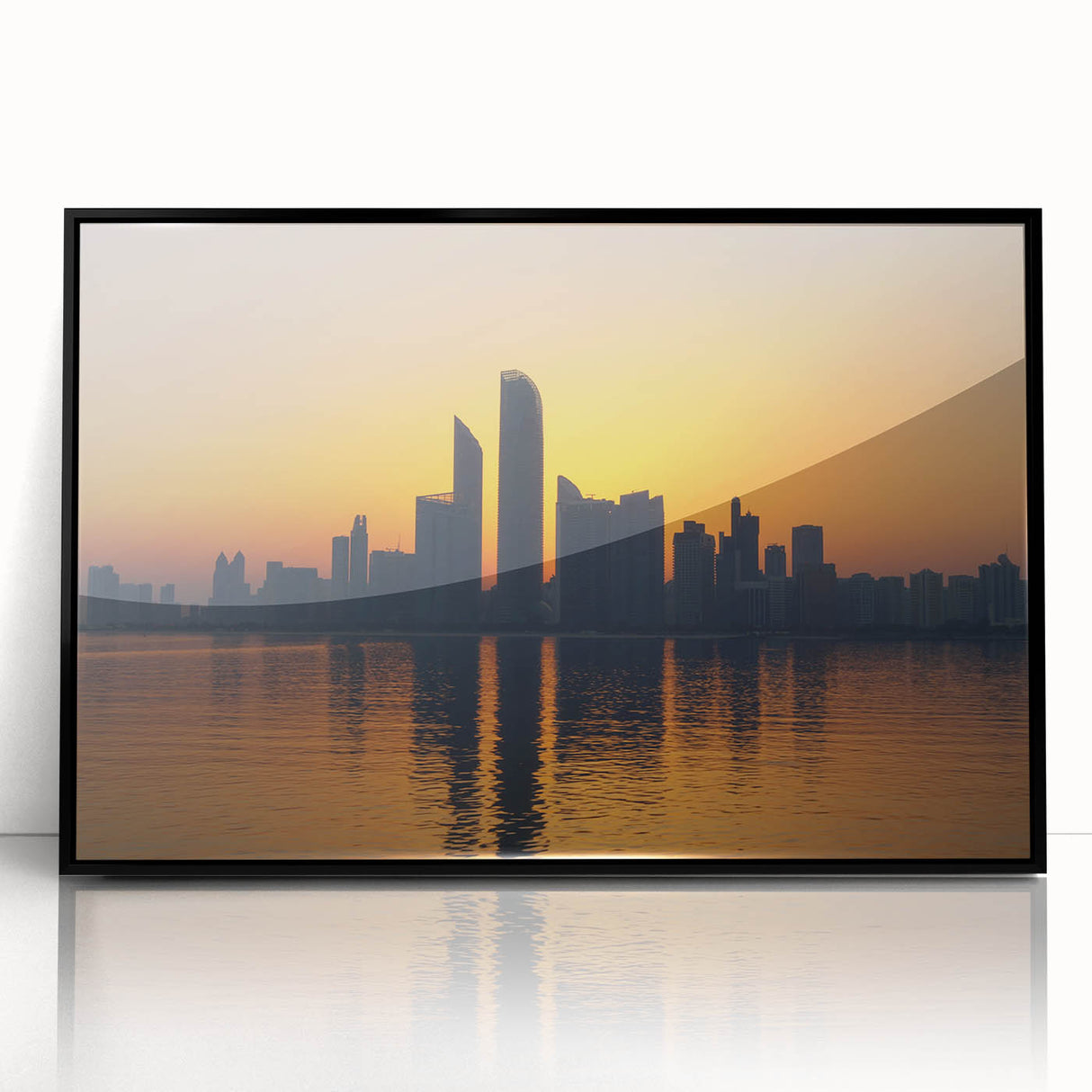 Large abstract wall art depicting the Abu Dhabi skyline in muted gray and blue tones on a framed acrylic print.