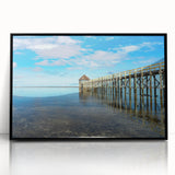 Large abstract wall art featuring a serene Fiji scenery in muted blue and green tones, framed in black acrylic.