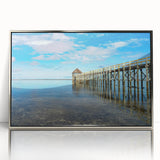 Mid-century modernist art depicting a serene Fiji seascape in muted blue and green hues on a silver-framed acrylic print.