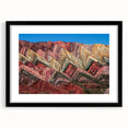 Colorful abstract art print of an Argentine scene, rendered in textured hues, set in a large black frame with mat.