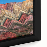 Black framed canvas featuring a textured, colorful abstract of Argentine scenery, ideal for living room decor.