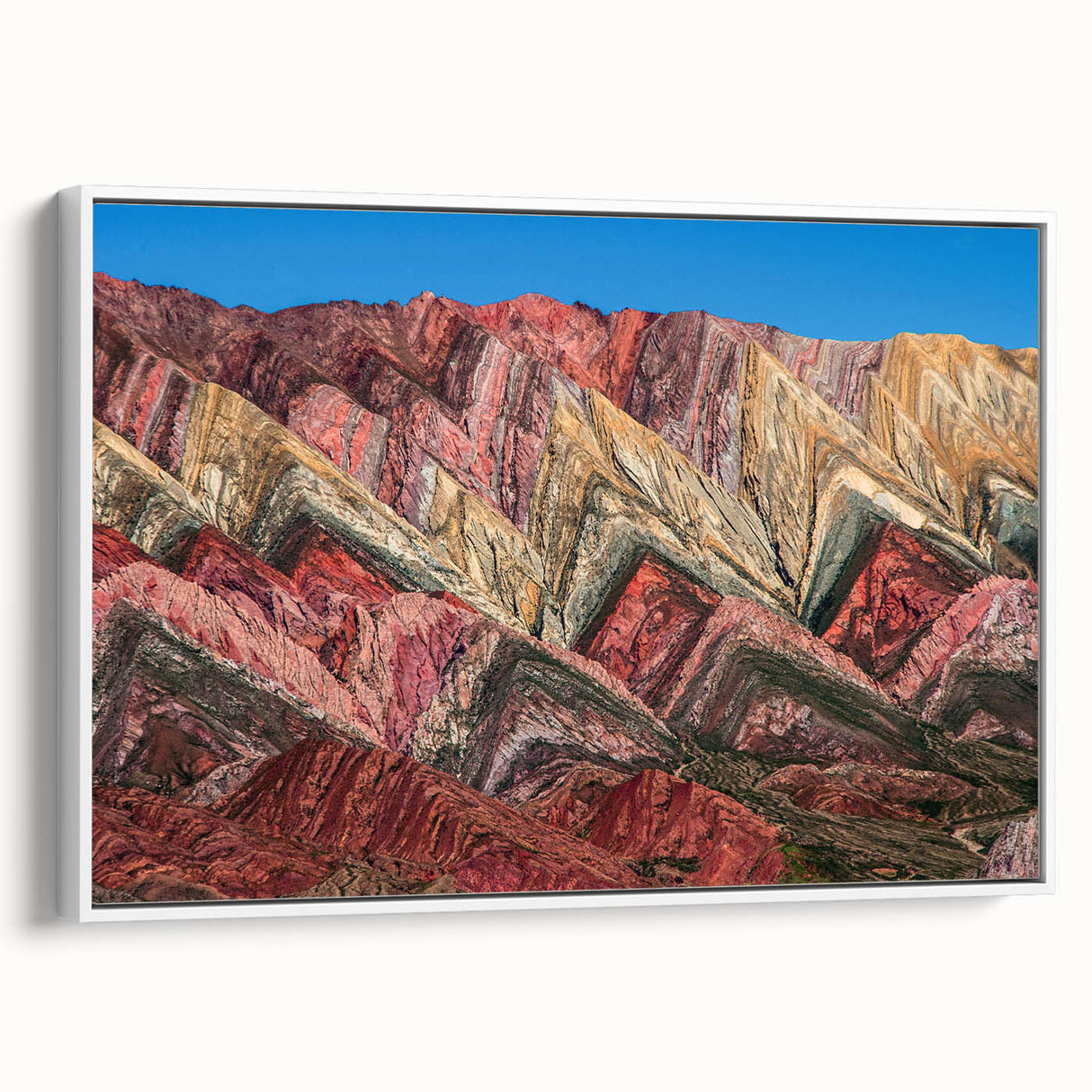 Framed canvas featuring a vintage poster art of an Argentine landscape with colorful imagery on a black background.