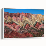 Framed canvas featuring a vintage poster art of an Argentine landscape with colorful imagery on a black background.