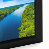 Extra large framed canvas featuring a textured depiction of a Brazilian landscape in black with colorful accents.