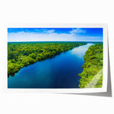 Extra large rolled print of a Brazilian landscape with lush greenery and vibrant flowers, ideal for dining room decor.