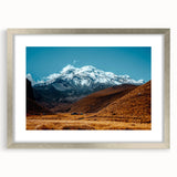 Textured abstract art print depicting a South American scenery in muted earth tones on a silver-framed mat.