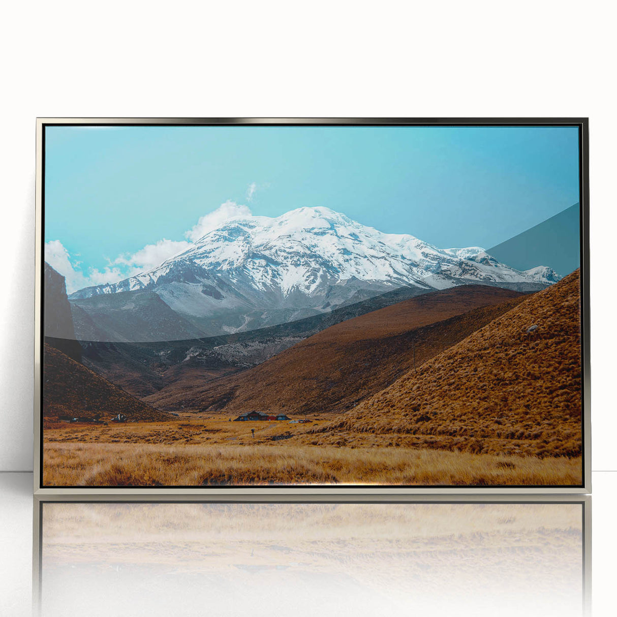 Mid-century modernist art depicting a serene Ecuadorian landscape in muted earth tones on a silver-framed acrylic print.
