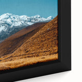 Black wall art depicting a textured, colorful South American scenery on a framed canvas, ideal for living room decor.