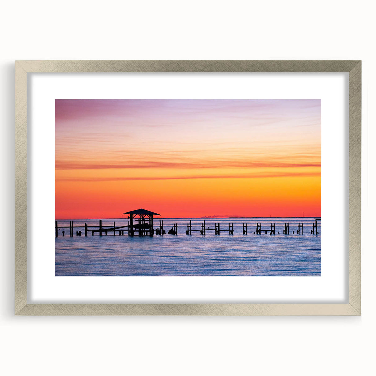 Textured abstract art print of Alabama scenery in muted earth tones on a framed silver mat, suitable for bedroom decor.