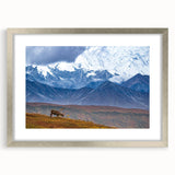 Textured abstract art print of Alaskan scenery in muted earth tones, framed in silver, ideal for bedroom wall decor.