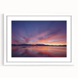 Abstract art print of Lake Tahoe with a white matte frame, featuring blue and green hues, ideal for dining room decor.