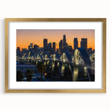 Extra large abstract art print of Los Angeles skyline in gold frame.