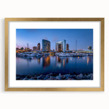 Extra large abstract art print of San Diego skyline in muted earth tones on a textured canvas, framed in gold.