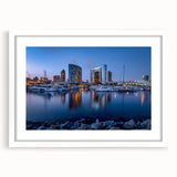 Abstract art print of San Diego skyline in muted blue and gray tones, framed in white.