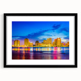 Abstract art print of a colorful New Orleans scene in vibrant hues on a large framed canvas, ideal for living room decor.