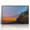 Large abstract wall art depicting Acadia's rugged coastline in cool blue and gray tones, framed in black acrylic.