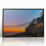 Large abstract wall art depicting Acadia's rugged coastline in cool blue and gray tones, framed in black acrylic.