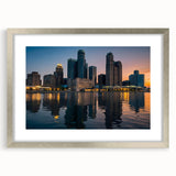 Textured abstract art print of Detroit skyline in muted gray and silver tones, framed with a silver mat.