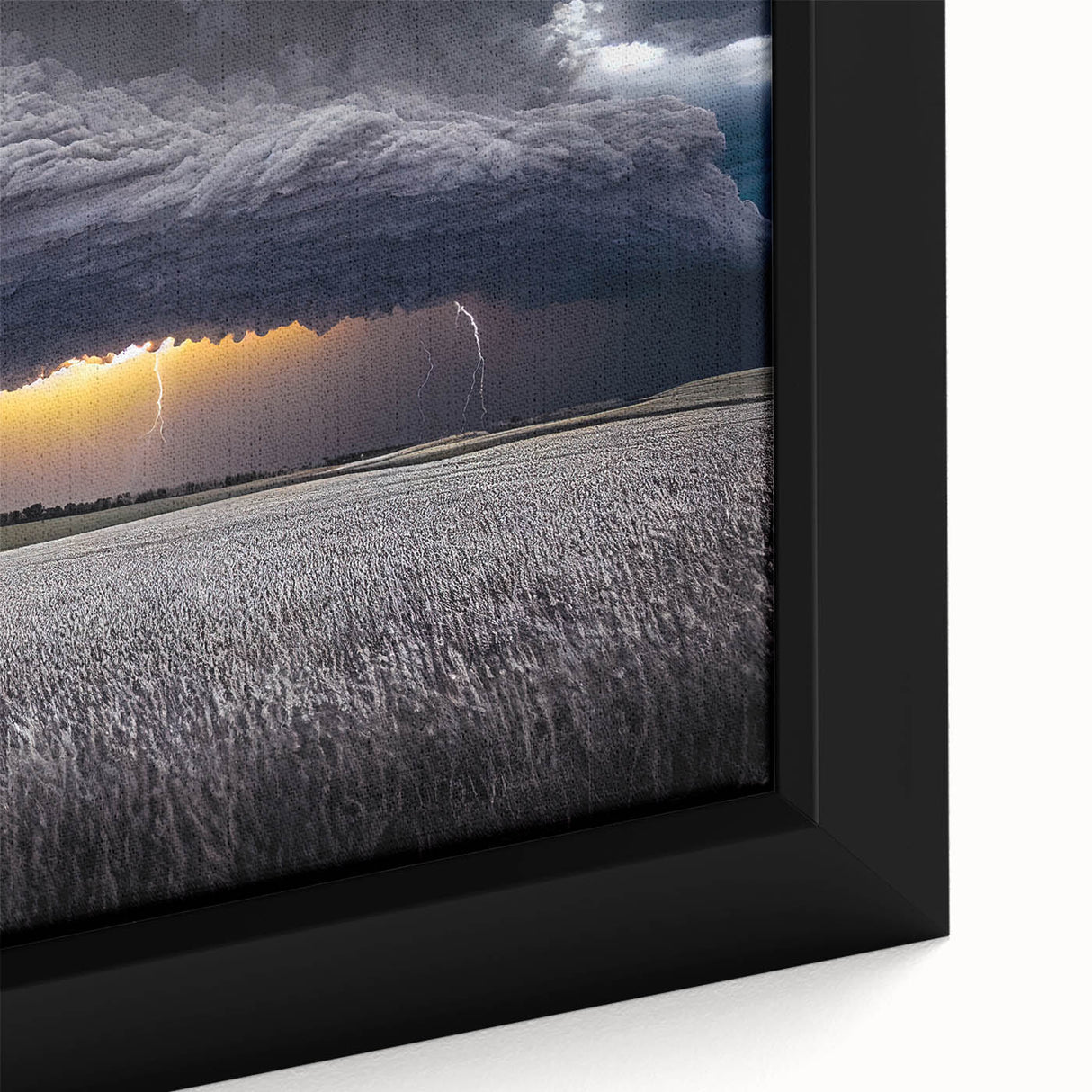 Close-up of black wall art featuring a textured, colorful depiction of the Palouse scenery on a framed canvas.
