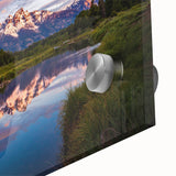 Mid-century modernist style depiction of the Grand Tetons, in muted earth tones on acrylic glass, ideal for dining room art.