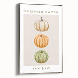 Framed canvas depicting a vintage-style landscape painting with autumnal trees in vibrant orange and red tones.