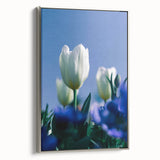 Framed canvas depicting a vintage-style landscape with colorful spring scenery, ideal for enhancing a living room's decor.