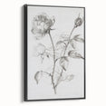 Framed canvas artwork showcasing abstract floral design in vibrant colors, set against a sleek black frame, ideal for modern home decor. Perfect for adding elegance to living spaces.