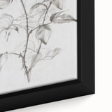 Close-up of a framed canvas featuring vibrant abstract floral designs in shades of pink, green, and blue, perfect for modern home decor.