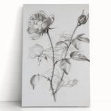 Abstract floral canvas art featuring vibrant colors of pink, blue, and green, elegantly leaning against a wall, perfect for modern home decor.