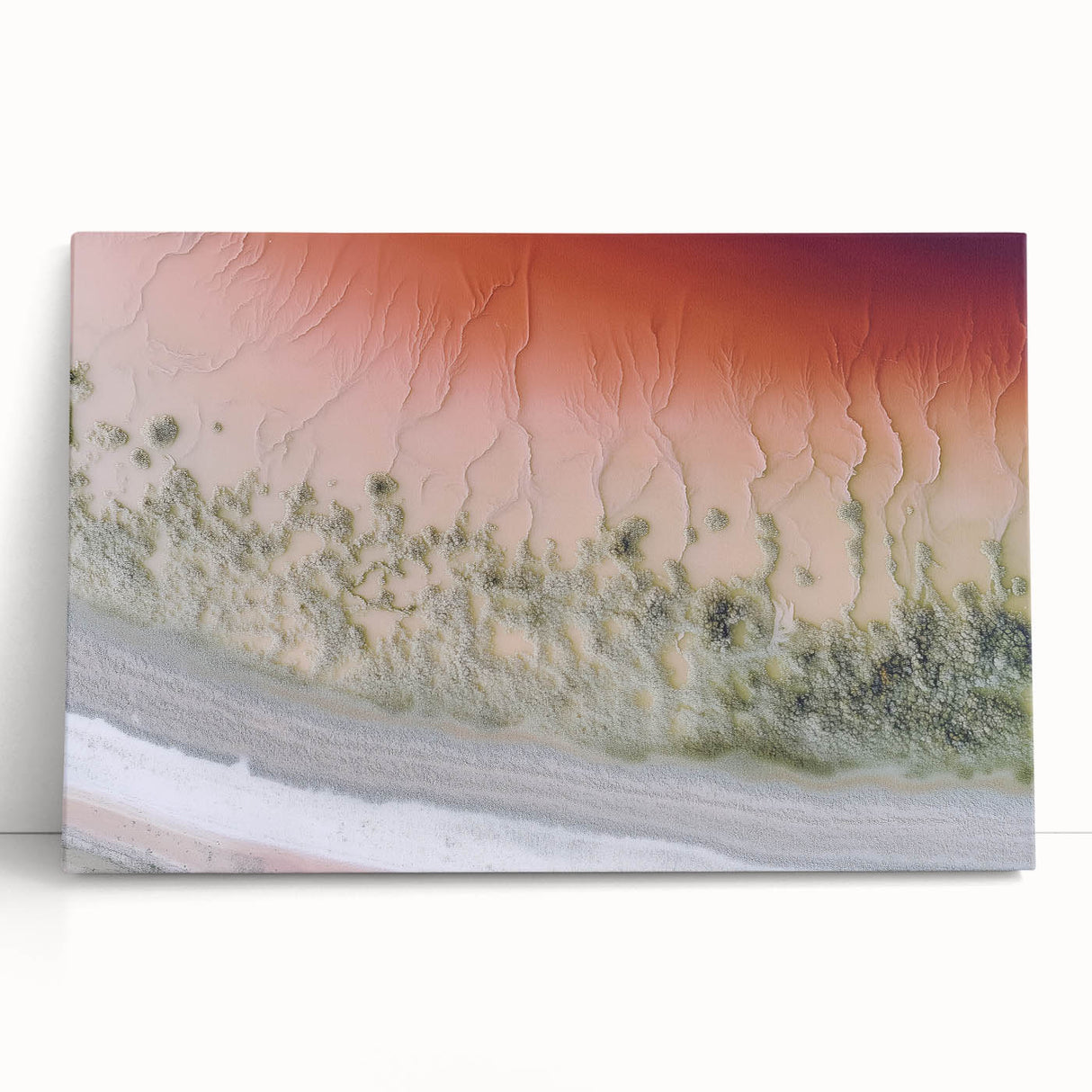 Abstract landscape stretched canvas art showcasing vibrant colors of blue, orange, and green, elegantly leaning against a wall, perfect for modern interior decor.