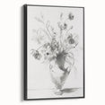 Framed canvas artwork showcasing an abstract floral design in vibrant colors, featuring a sleek black frame, ideal for modern home decor.
