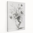Abstract floral stretched canvas artwork showcasing vibrant colors like pink, blue, and green, elegantly displayed from a side view, perfect for home decor enhancement.