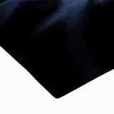 Large art of a black and white landscape painting featuring an assortment of fruits on a stretched canvas.