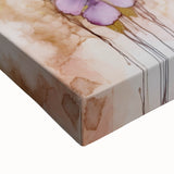 Close-up view of an abstract floral stretched canvas artwork showcasing vibrant colors and intricate patterns, perfect for modern home decor or art enthusiasts.