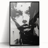 Framed minimalist abstract wall art design featuring bold black shapes on a white background, ideal for modern home decor. Perfect for enhancing interior aesthetics.