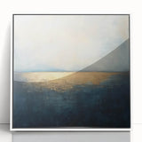 Framed abstract landscape artwork featuring a blend of soft earth tones and vibrant blues, elegantly displayed in a white frame, ideal for modern home decor.