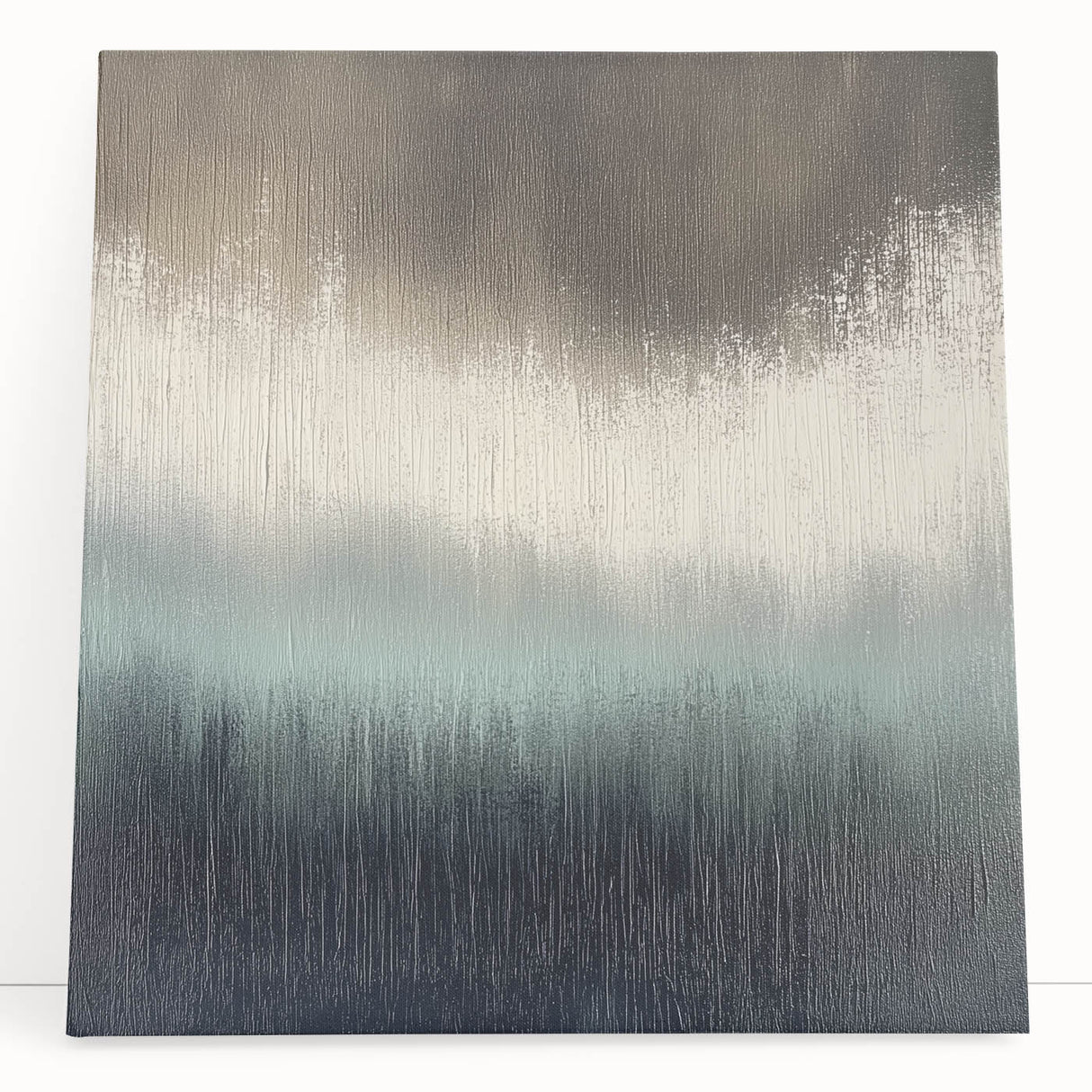 Abstract landscape canvas art featuring soft, muted colors of blue, green, and beige, leaning against a wall, perfect for modern home decor. Ideal for creating a serene and stylish atmosphere in living spaces.