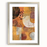 Textured abstract art print in warm autumn hues on a silver-framed canvas, suitable for bedroom decor.