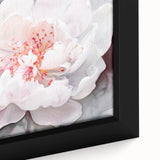 Close-up of a framed abstract floral canvas artwork featuring vibrant colors and intricate details, ideal for modern home decor and wall enhancement.