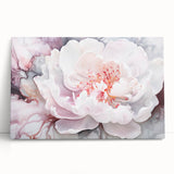 Abstract floral design stretched canvas artwork leaning against a neutral wall. Vibrant colors in shades of pink, blue, and gold create a modern decorative piece, ideal for enhancing contemporary interiors.
