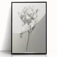 Framed acrylic wall art featuring abstract floral design in vibrant colors, set against a sleek black frame, perfect for modern home decor.