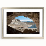 Framed landscape artwork depicting a serene cave scene, featuring a silver mat and a sleek frame, ideal for modern home decor and art enthusiasts.