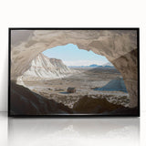 Framed acrylic artwork showcasing a striking landscape of caves, featuring deep colors and intricate details, presented in a sleek black frame for elegant decor enhancement.