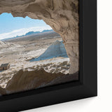 Close-up of a framed canvas artwork depicting dramatic landscapes and intricate cave formations, showcasing earthy tones of browns and greens, perfect for modern home decor.