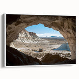Framed canvas artwork showcasing a stunning landscape with intricate cave formations, presented in a sleek white frame, ideal for modern home decor.