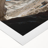 Rolled canvas print showcasing a stunning landscape with intricate cave formations, ideal for home decor. Packaged securely in a durable cardboard tube for safe shipping.