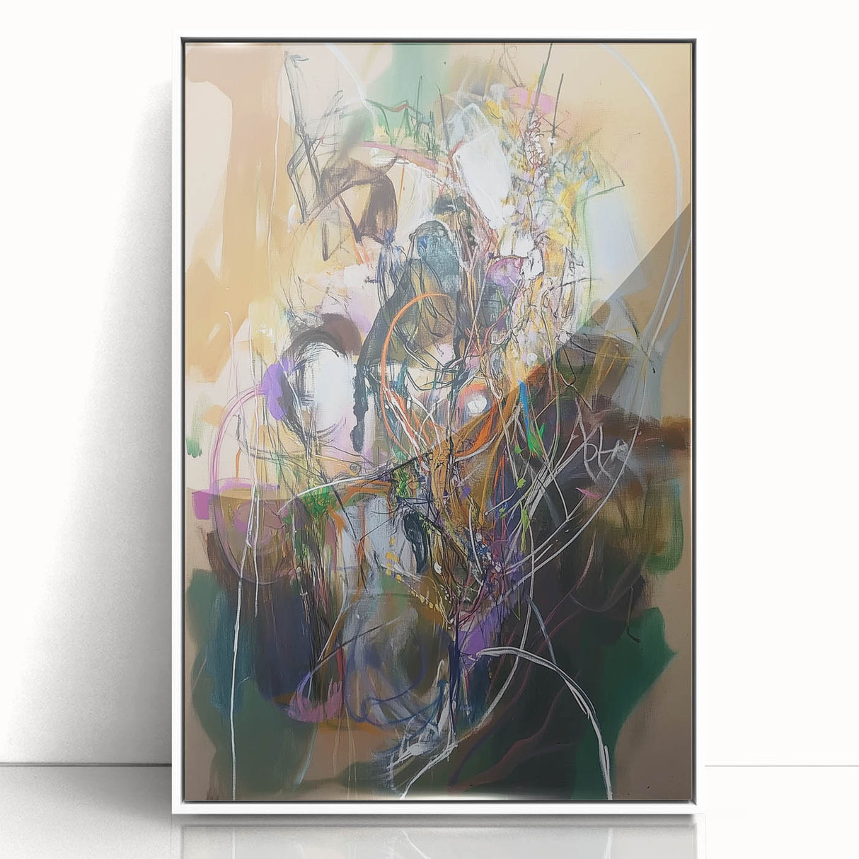 Abstract wall art featuring colorful splatters in a framed acrylic display, showcasing vibrant hues of blue, yellow, and red against a sleek white background, perfect for modern home decor.
